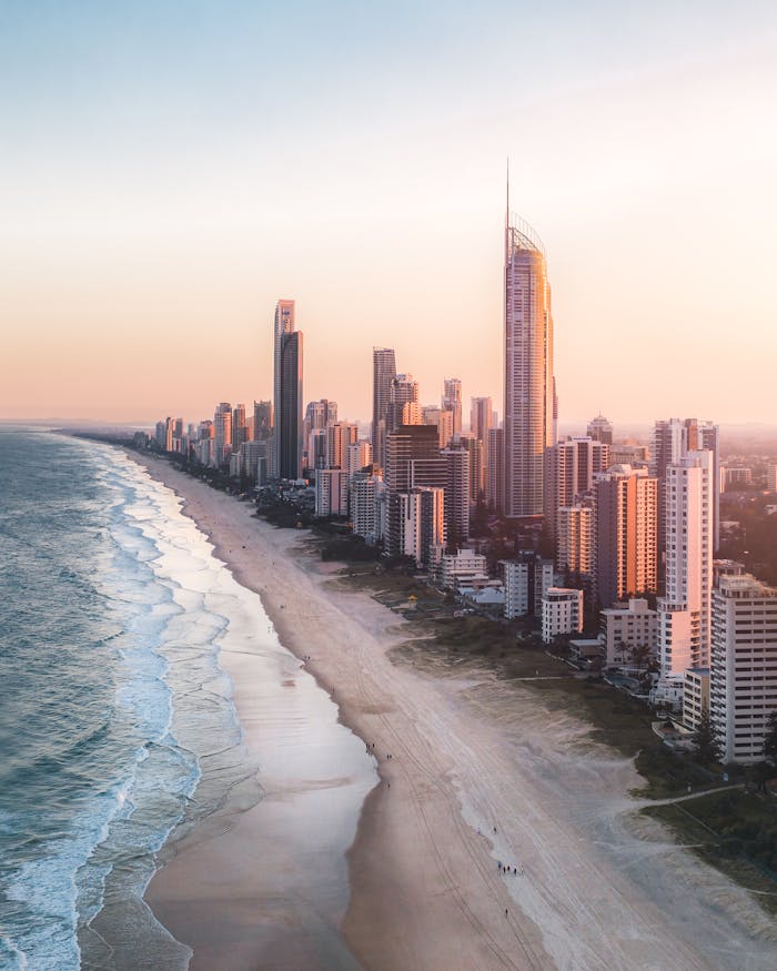 Captivating aerial shot of Surfers Paradise skyline and beach during a vibrant sunset in Australia.